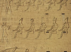 Hieroglyphic carvings on the exterior walls of an ancient egyptian temple