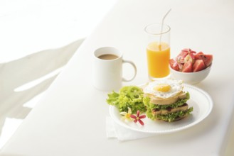 Egg and salad sandwich with fruit salad juice and coffee breakfast set