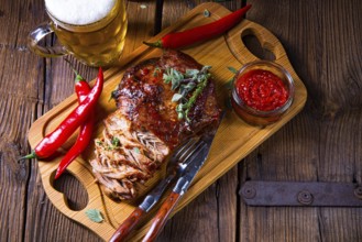 Pork with beer sauce pulled from the oven