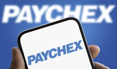 Paychex logo is displayed on smartphone