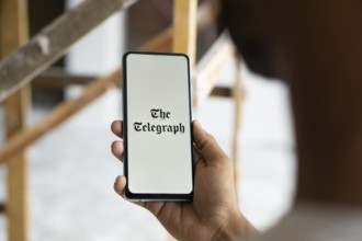 the telegraph logo is displayed on smartphone. The Telegraph is a British daily broadsheet
