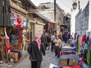 Busy souk market shopping street in old town of aleppo syria
