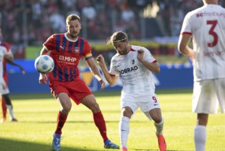 Football match, Lucas HÖLER SC Freiburg right, heads the ball and keeps an eye on it together with
