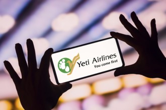 In this photo illustration, the Yeti Airlines logo is displayed on a smartphone screen