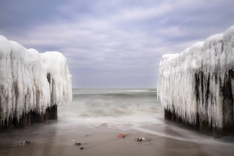 Groyne in winter on the coast of the Baltic Sea near Kühlungsborn