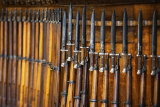 Old wood riffles with bayonets on them