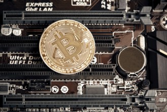 Bitcoin. New virtual money. Bitcoins lie on the video card, concept of mining. Flat lay. Top view.