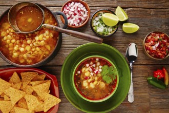 Pozole with mote big corn stew from Mexico with ingredients and appetizer