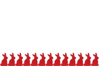 Red Easter bunnies in a row - isolated on white background Row of red easter bunnies - isolated on