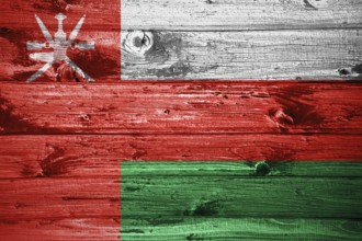 Oman flag on wooden planks background wood flag