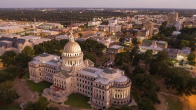 Aerial Perspective as night falls over the buildings and streets of Jackson Mississippi