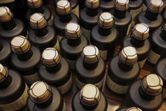 Small bottles, sealed with corks and wire