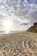 Incredible rock formations by the sea. Red cliffs with red earth and breathtaking formations on the