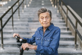 90 year old woman with grey hair, wrinkles, progressive and active uses modern electric transport