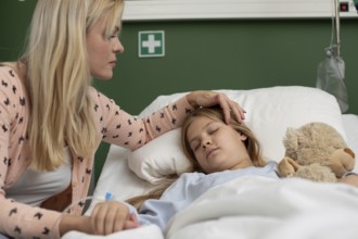 A devoted mother cares for her sick child in the hospital, showing unconditional love and