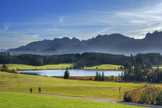 Autumnal Attlesee with Allgäu foothills and walks near Nesselwang, Allgäu, Bavaria, Germany