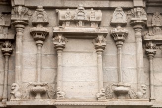 Richly relief stone carved pillars and mandapam on the wall of south gopuram of Shree Meenakshi