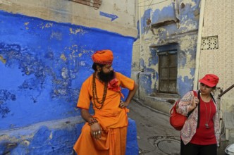 Woman looking at old priest, Jodhpur, Rajasthan, India, Asia