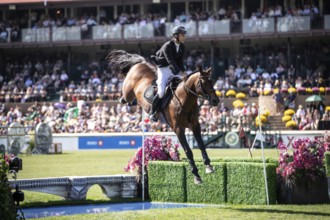 Richard Vogel of Germany and riding United Touch S compete in the first round of the 1.60m CPKC