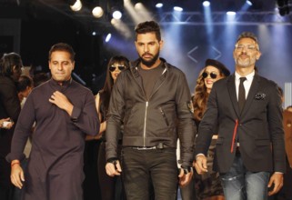 Indian cricket player Yuvraj Singh fashion designers Shantanu Nikhil walks ramp launch clothing