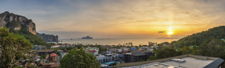 Tropical sea sunset at Ao Nang Beach with limestone mountain, Krabi Thailand high angle view nature