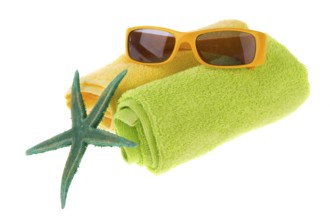 Green towel, starfish and sunglasses for the beach