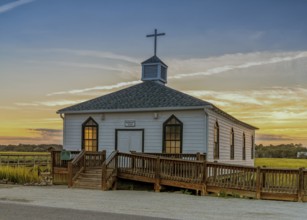 View of the historic Pawleys Island Chapel on the marsh at sunset