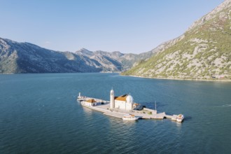 Church of Our Lady of the Rocks on the island of Gospa od Skrpjela. Bay of Kotor, Montenegro. Drone