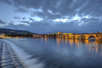 The famous Charles Bridge and Hradcany Castle in Prague at dusk