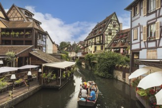 Little Venice (La Petite Venise), tourists enjoying a boat trip on the canal, Colmar, Alsace, Grand