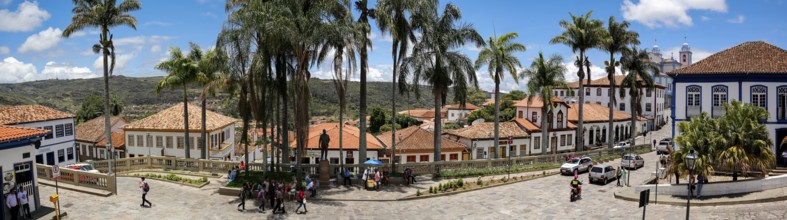 Panorama of traditional houses and palm tree lined street in historic center of Diamantina on a