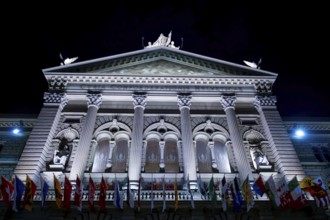 Beautiful Bundeshaus Illuminated Parliament Building or Federal Palace with Canton Flags at Night