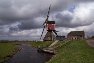 Heavy clouds above the Hoogmadese windmill near the Dutch village Hoogmade