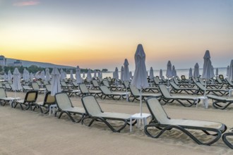 Chairs and umbrellas on a beautiful beach at sunrise in Sunny Beach on the Black Sea coast of