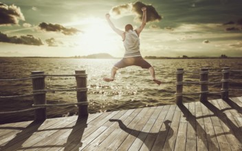 Cliff Jumping into the Ocean at Sunset, Summer Fun Lifestyle
