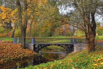 Autumn landscape in Catherine Park, Pushkin, Russia, view of the river and the bridge