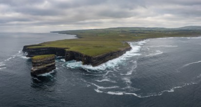 A panorama landscape view of the wild and rugged coastline of County Mayo in Ireland with the