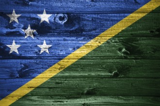 Solomon Islands flag on wooden planks background wood flag