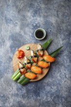 Food, Sashimi sushi set on wooden board. Stone background. Top view