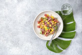 Food, Food, Tropical Hawaiian tahitian tuna mango salad on white plate on tropical monstera leafe