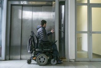 Handicapped male waiting for elevator