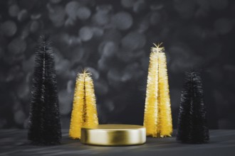 Podium pedestal product mockup display with miniature Christmas trees in black and gold, 3d
