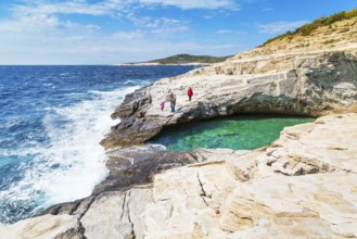 Thassos, Greece, May 2, 2016: People near Giola natural sea water pool located on Thassos island,