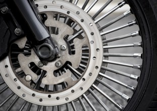 Motorbike front wheel close-up, outdoor on street. bike riding. Close up front wheel of a