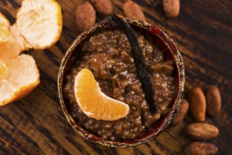 A bowl of chocolate tapioca pudding with fruits