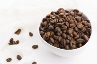 Bowl of caffee beans on a white background