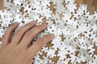 White jigsaw puzzle that has been placed on a desk. Shooting Location: Yokohama-city kanagawa