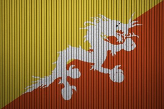 Bhutan flag painted on the cracked grunge concrete wall