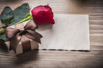Red rosebud present box blank sheet of paper holiday concept
