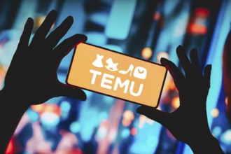 In this photo illustration, the Temu logo is displayed on a smartphone screen
